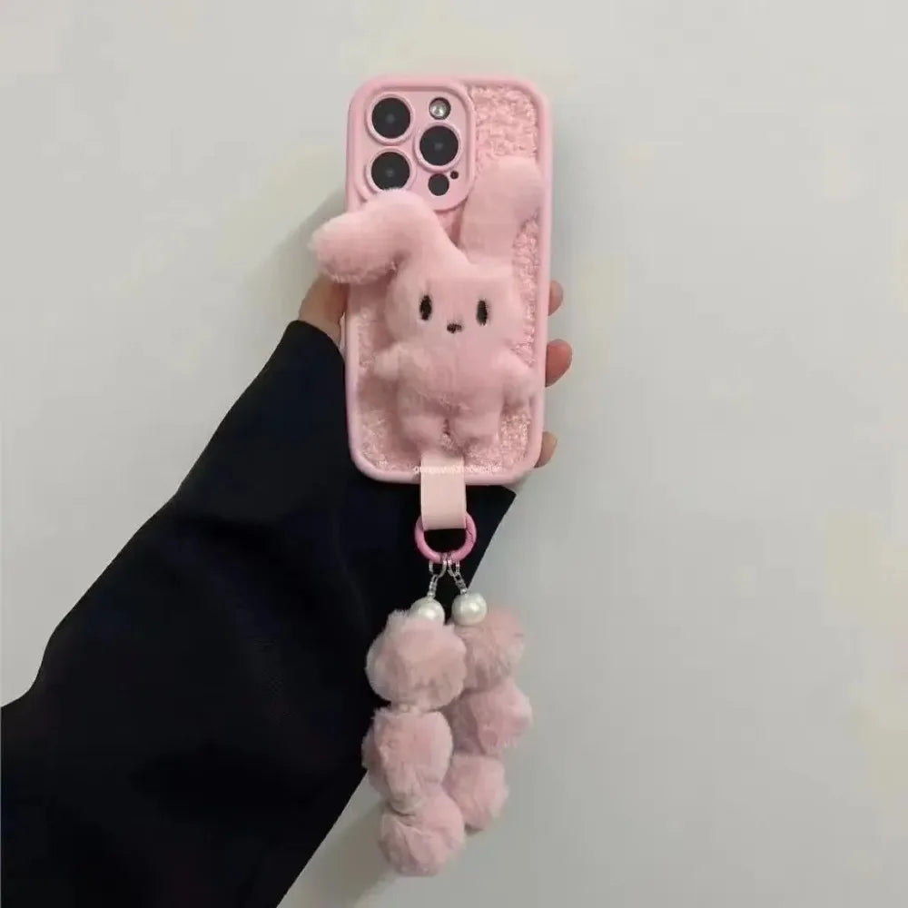 Bunny plush pink foldable-eared rabbit phone case with pink wrist strap.