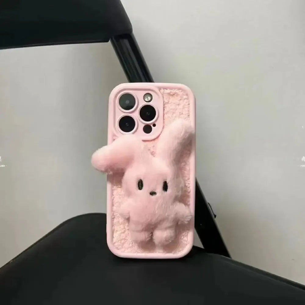 Bunny plush pink foldable-eared rabbit phone case with pink wrist strap.