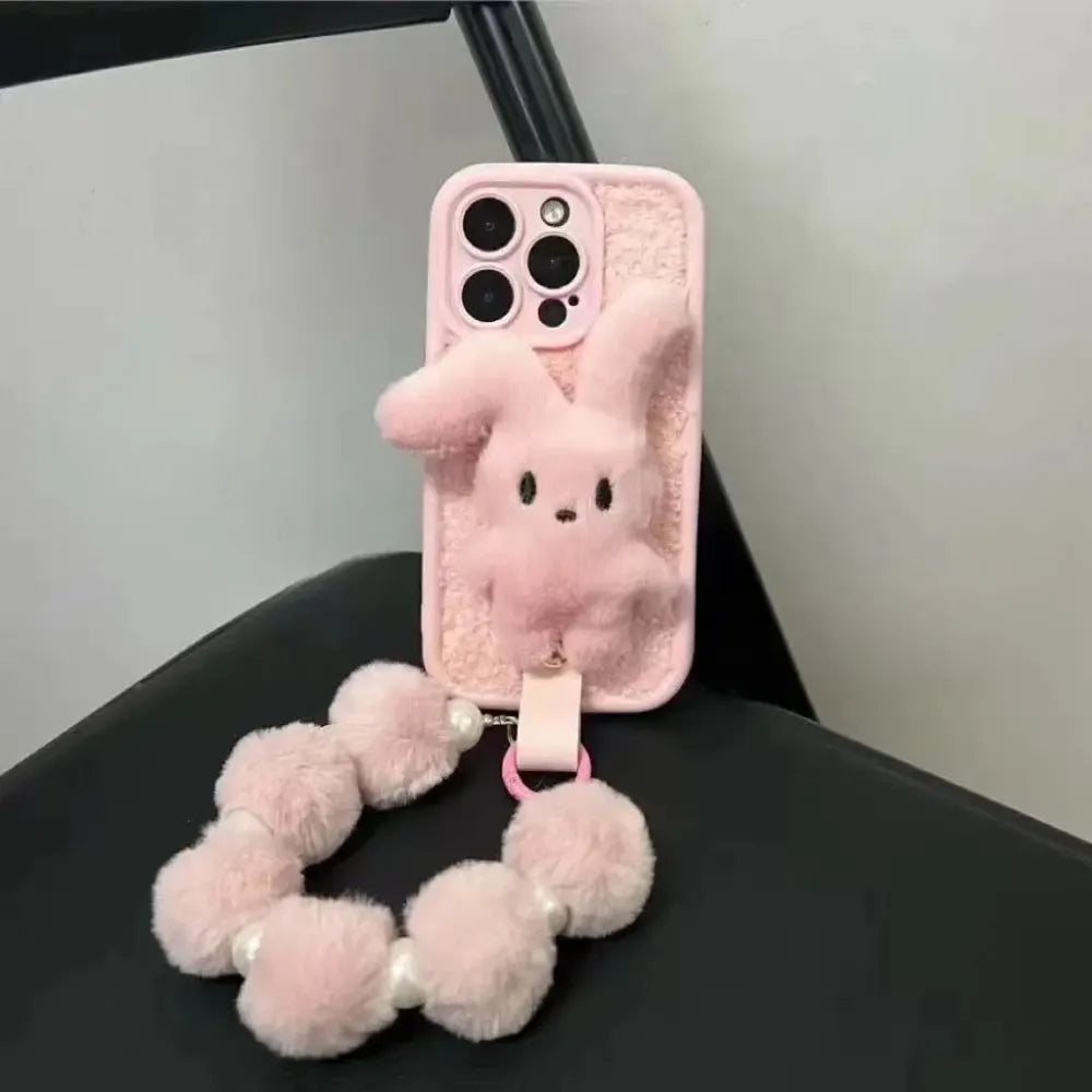 Bunny plush pink foldable-eared rabbit phone case with pink wrist strap.